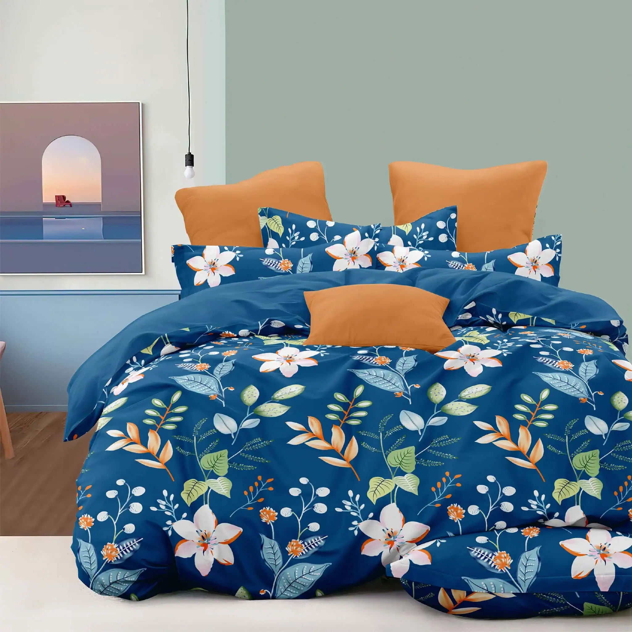 Sábana Piel de Durazno 140gr diseño floral azul con almohadas naranjas - JOSSline Ecuador